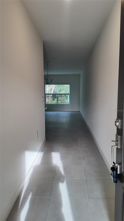 2798 Raindrop Run Street Clermont, FL 34714 - Photo 4 of 18 a view of an empty room and a window