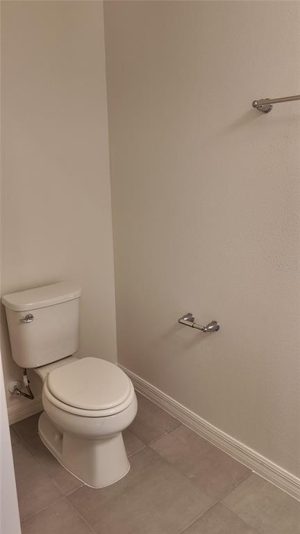 2798 Raindrop Run Street Clermont, FL 34714 - Photo 5 of 18 a white toilet sitting next to a shower