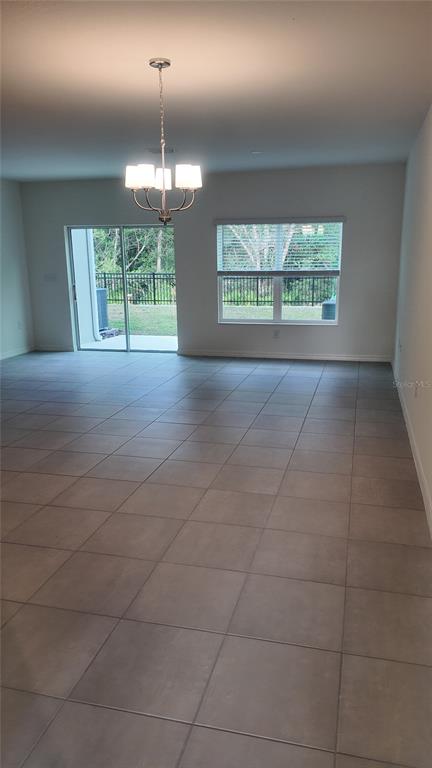 2798 Raindrop Run Street Clermont, FL 34714 - Photo 6 of 18 a view of an empty room with a window