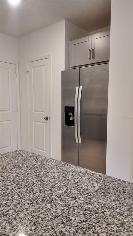 2798 Raindrop Run Street Clermont, FL 34714 - Photo 9 of 18 a bathroom with a granite countertop sink and a mirror