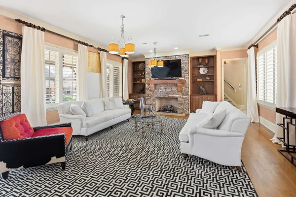a kitchen with center island table and chairs