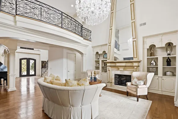 a living room with furniture and fireplace