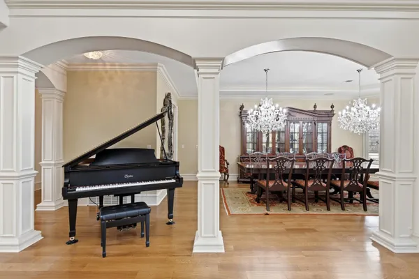 a dining room with lots of furniture and wooden floor