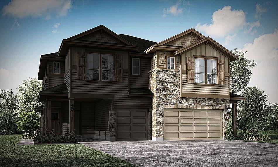 A spacious home with stone and wood siding, featuring two prominent garage doors and ample curb appeal.