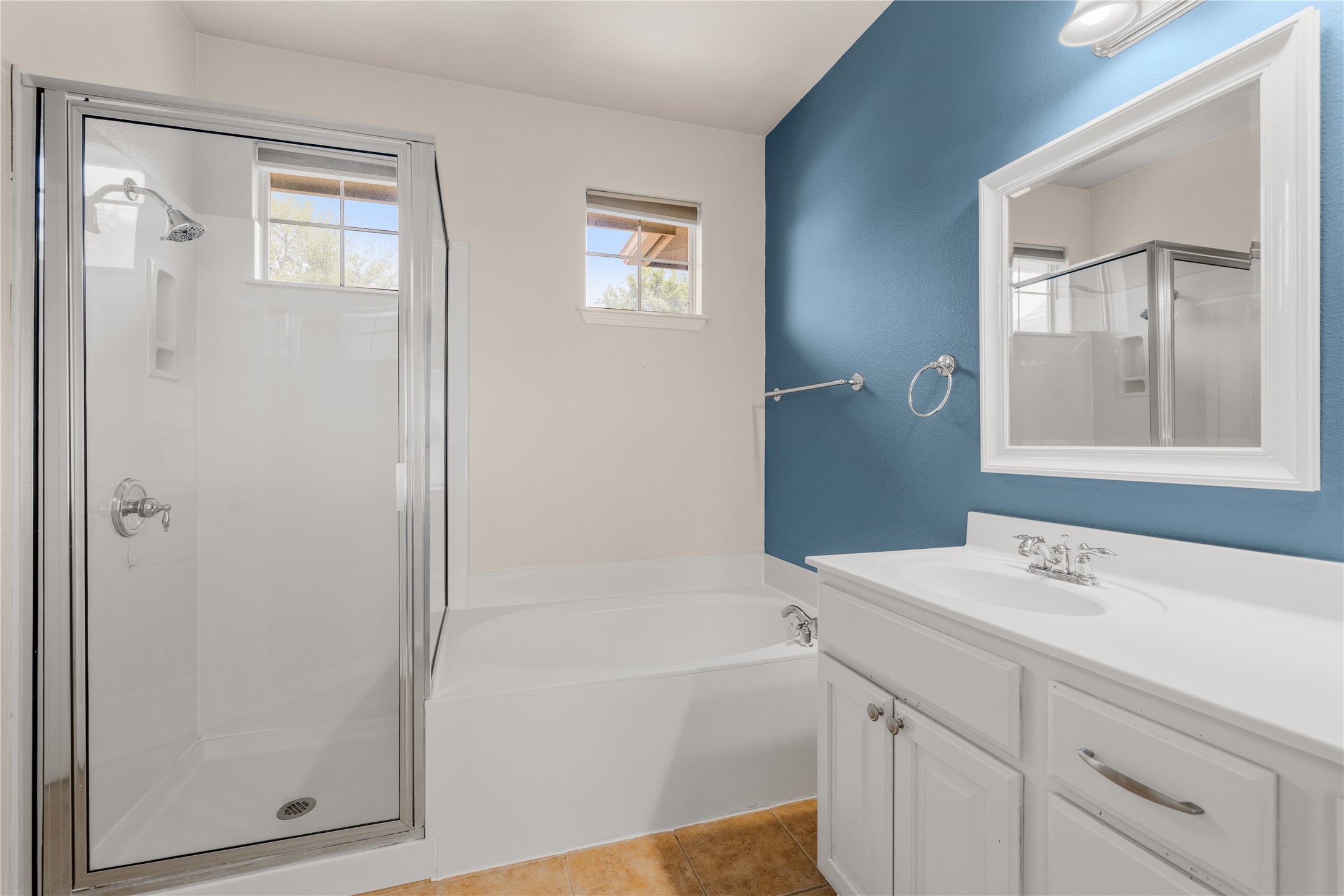11000 Anderson Mill Road, Unit 45 Austin, TX 78750 - Photo 15 of 32 a bathroom with a bathtub a sink a vanity and a mirror