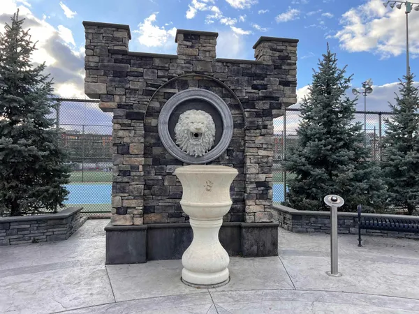 a view of a patio with table and chairs potted plants