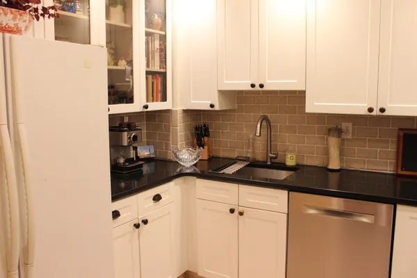 a kitchen with a sink and cabinets