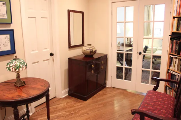 a living room with furniture a rug and a window