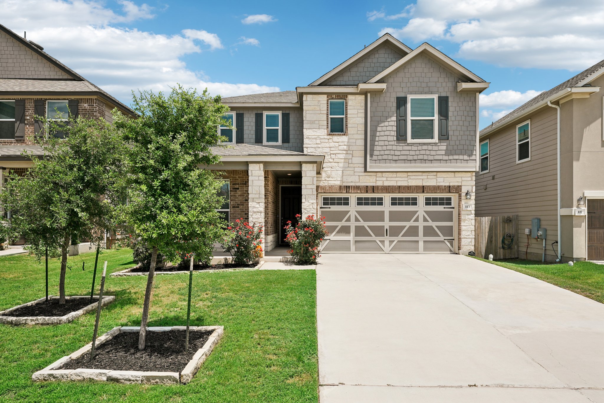 a front view of a house with a yard