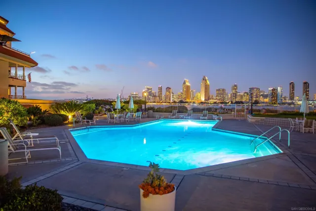 a view of a swimming pool with outdoor seating