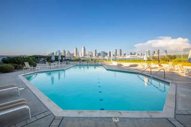 a view of a swimming pool and an outdoor seating