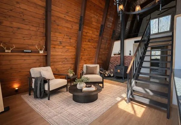 a view of living room filled with furniture and rug
