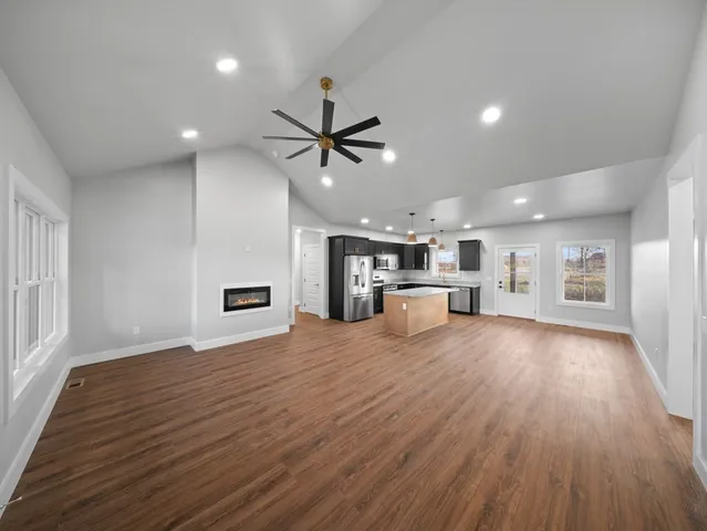 a view of a kitchen with a sink and a window
