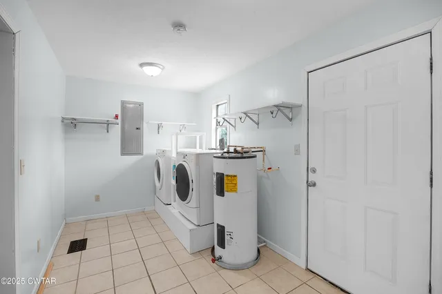 a bathroom with a toilet a sink and a mirror