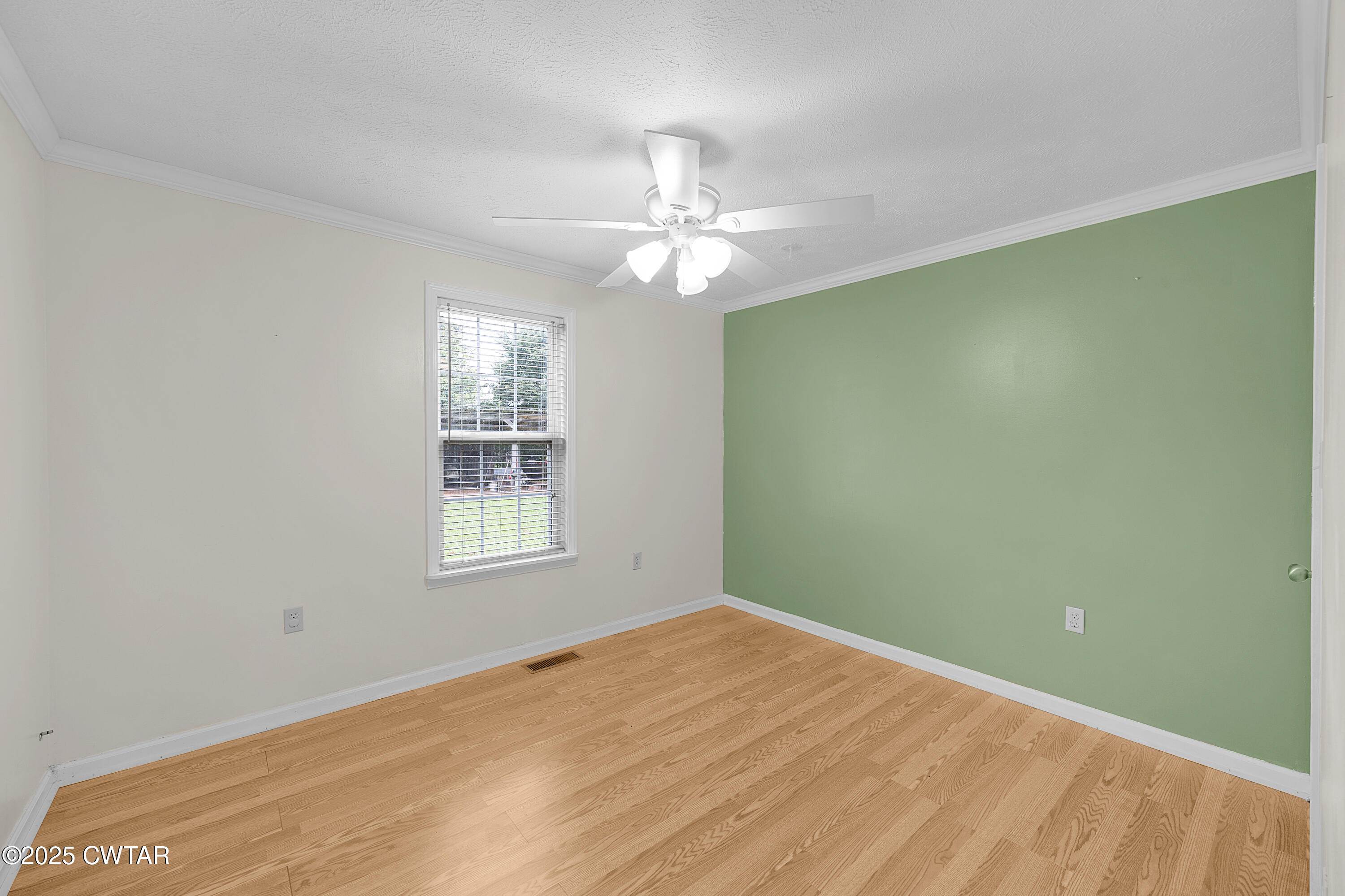 1675 Emerson Road Henderson, TN 38340 - Photo 19 of 21 wooden floor in an empty room with a window