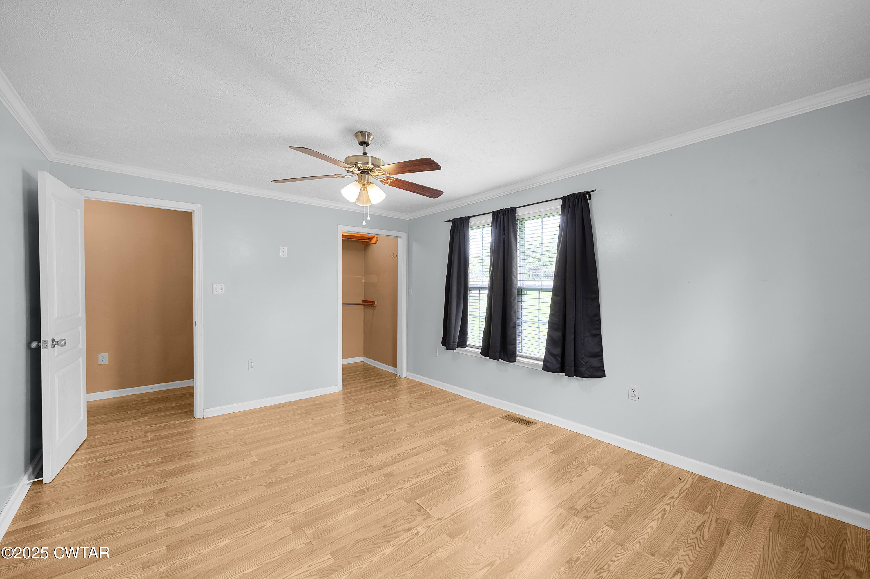 1675 Emerson Road Henderson, TN 38340 - Photo 21 of 21 a view of an empty room with window and chandelier fan