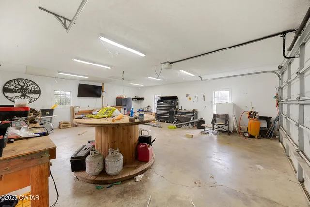 a kitchen with lots of counter top space and a window