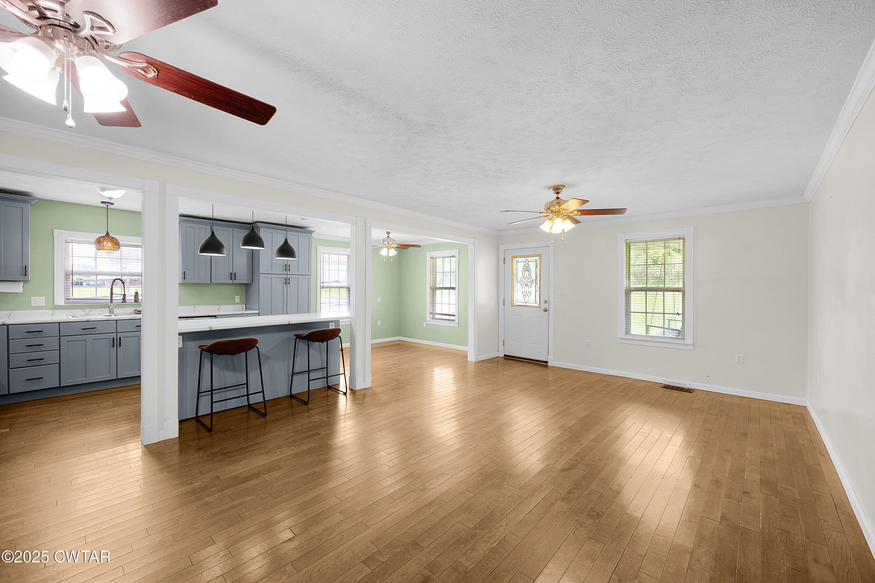 1675 Emerson Road Henderson, TN 38340 - Photo 10 of 21 a view of an empty room with window and wooden floor