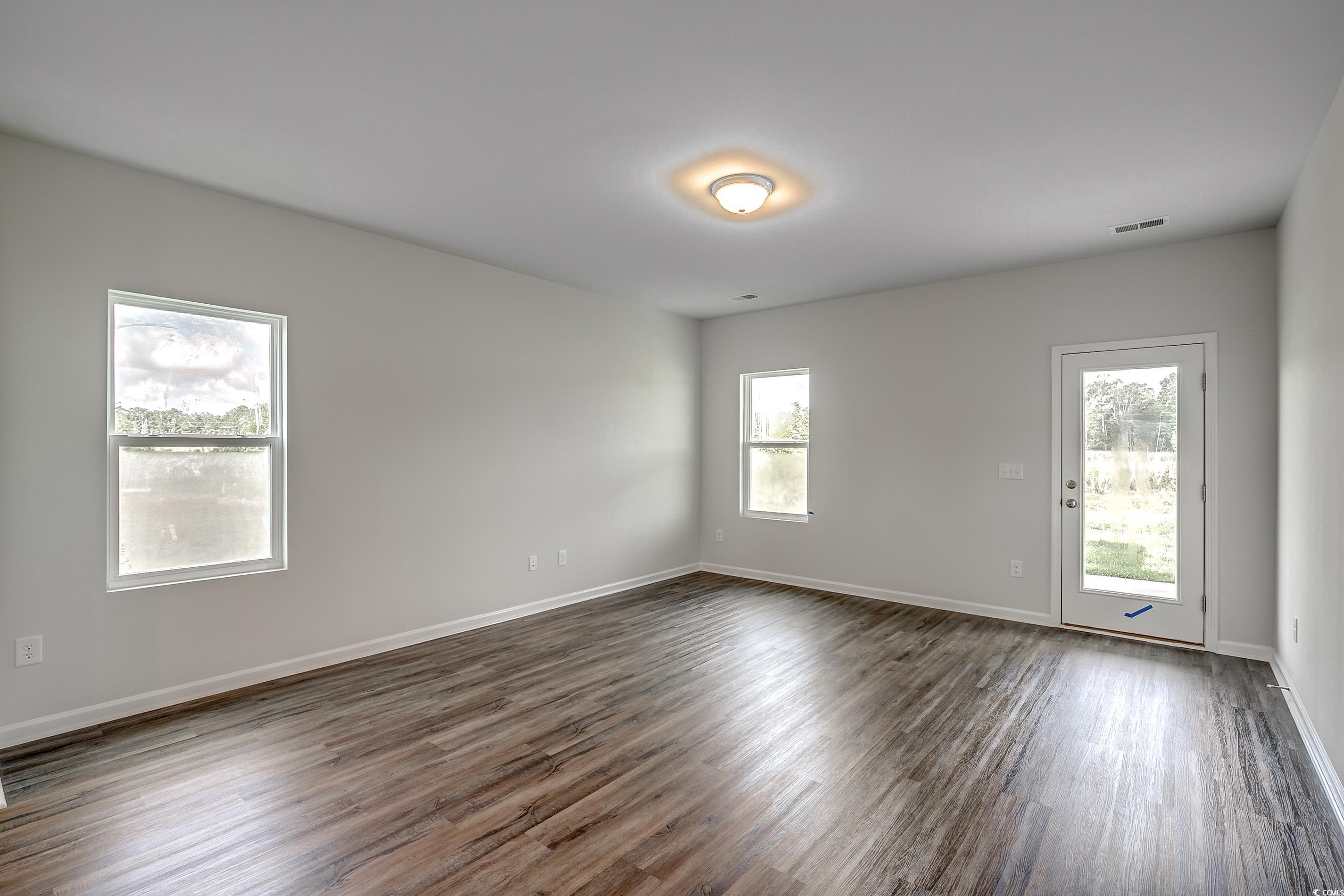 708 St Albans Loop Conway, SC 29526 - Photo 14 of 19 Spare room featuring dark wood-type flooring and a