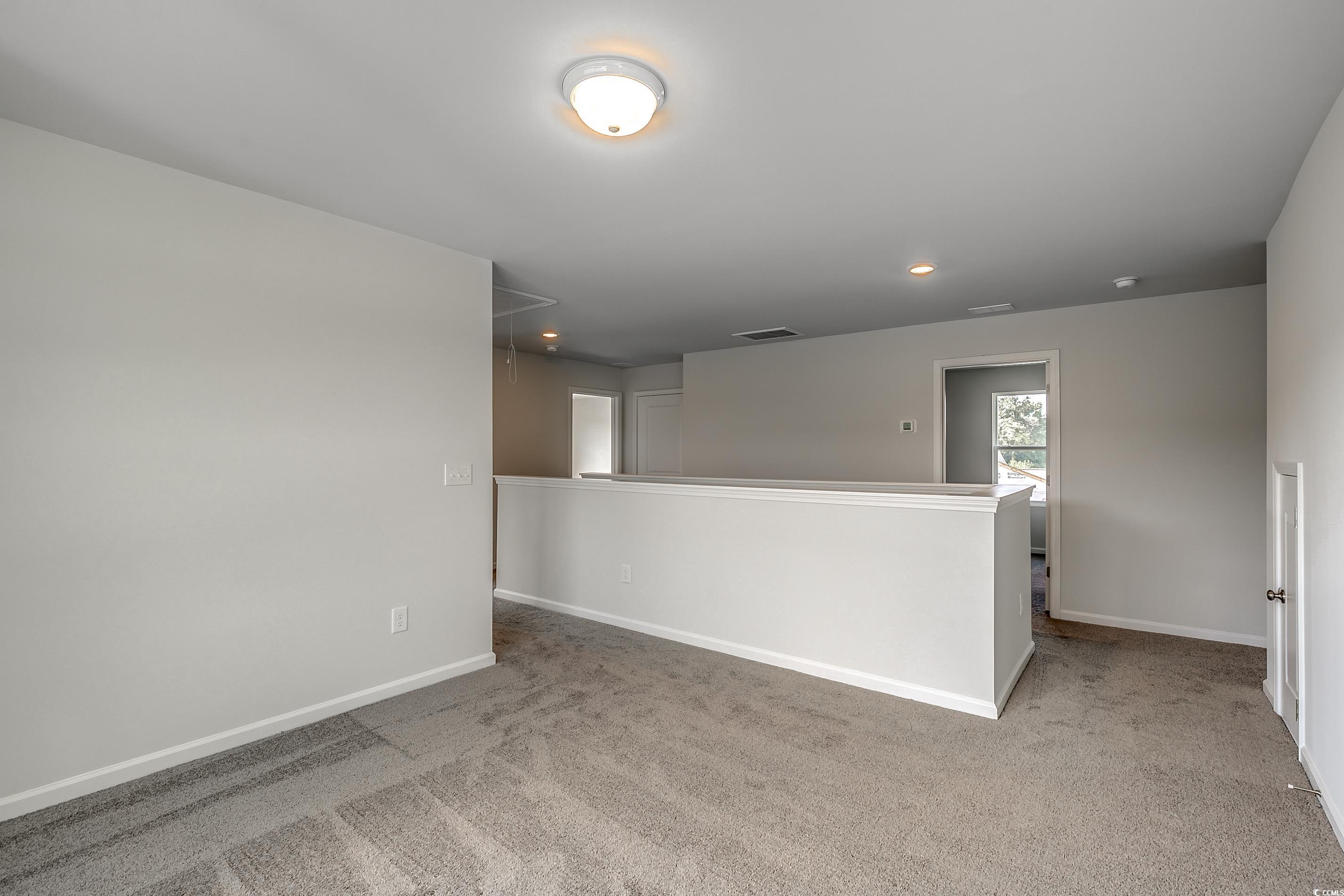 708 St Albans Loop Conway, SC 29526 - Photo 15 of 19 Empty room featuring light carpet
