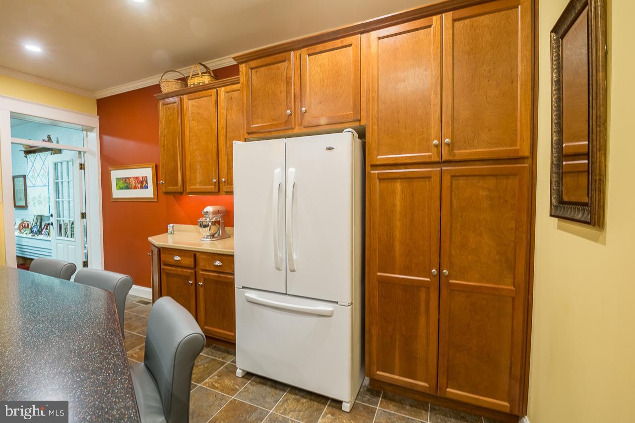 1043 Washington Street Reading, PA 19601 - Photo 12 of 40 a white refrigerator freezer sitting in a kitchen