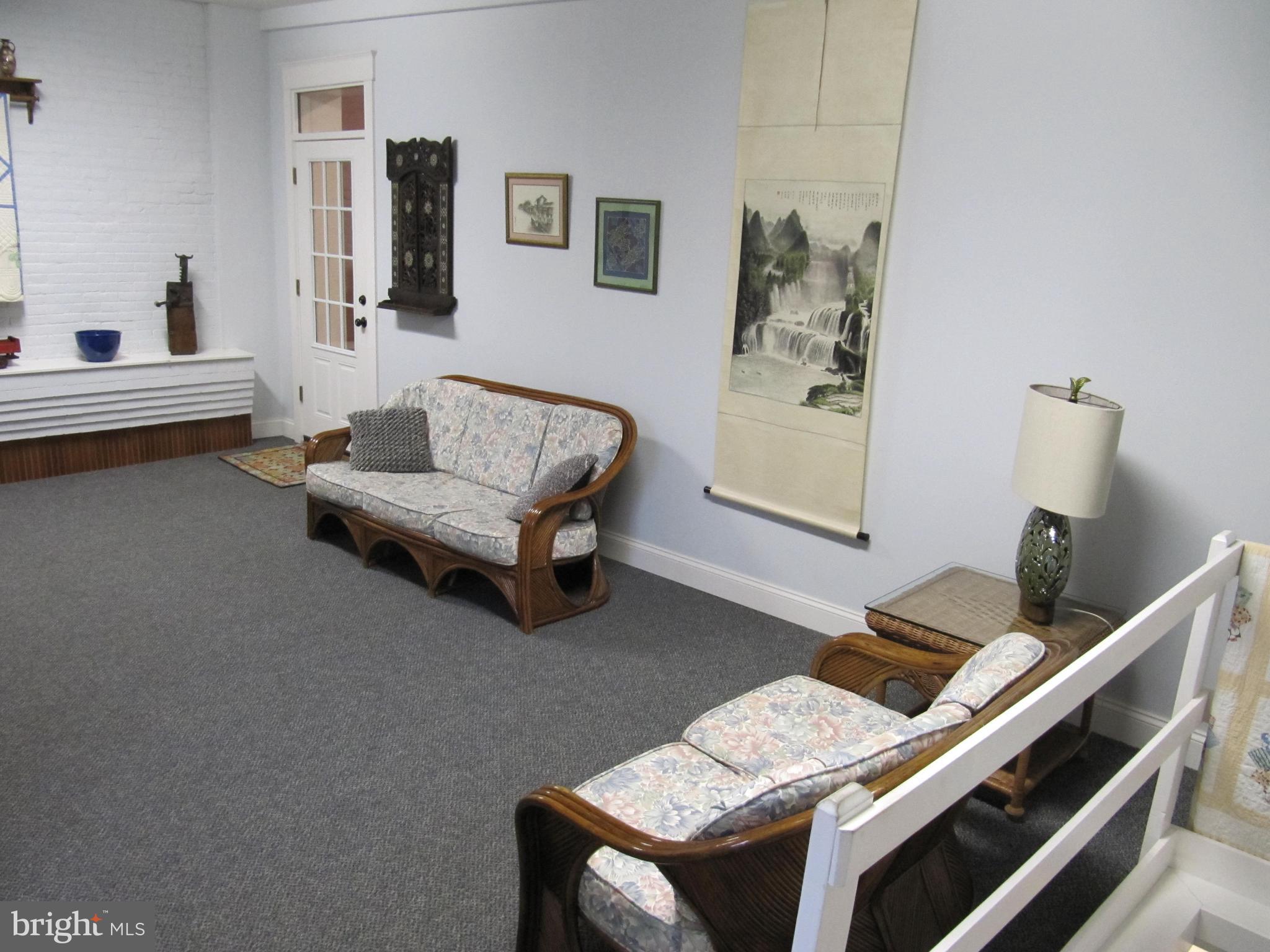 1043 Washington Street Reading, PA 19601 - Photo 19 of 40 a living room with furniture and a table