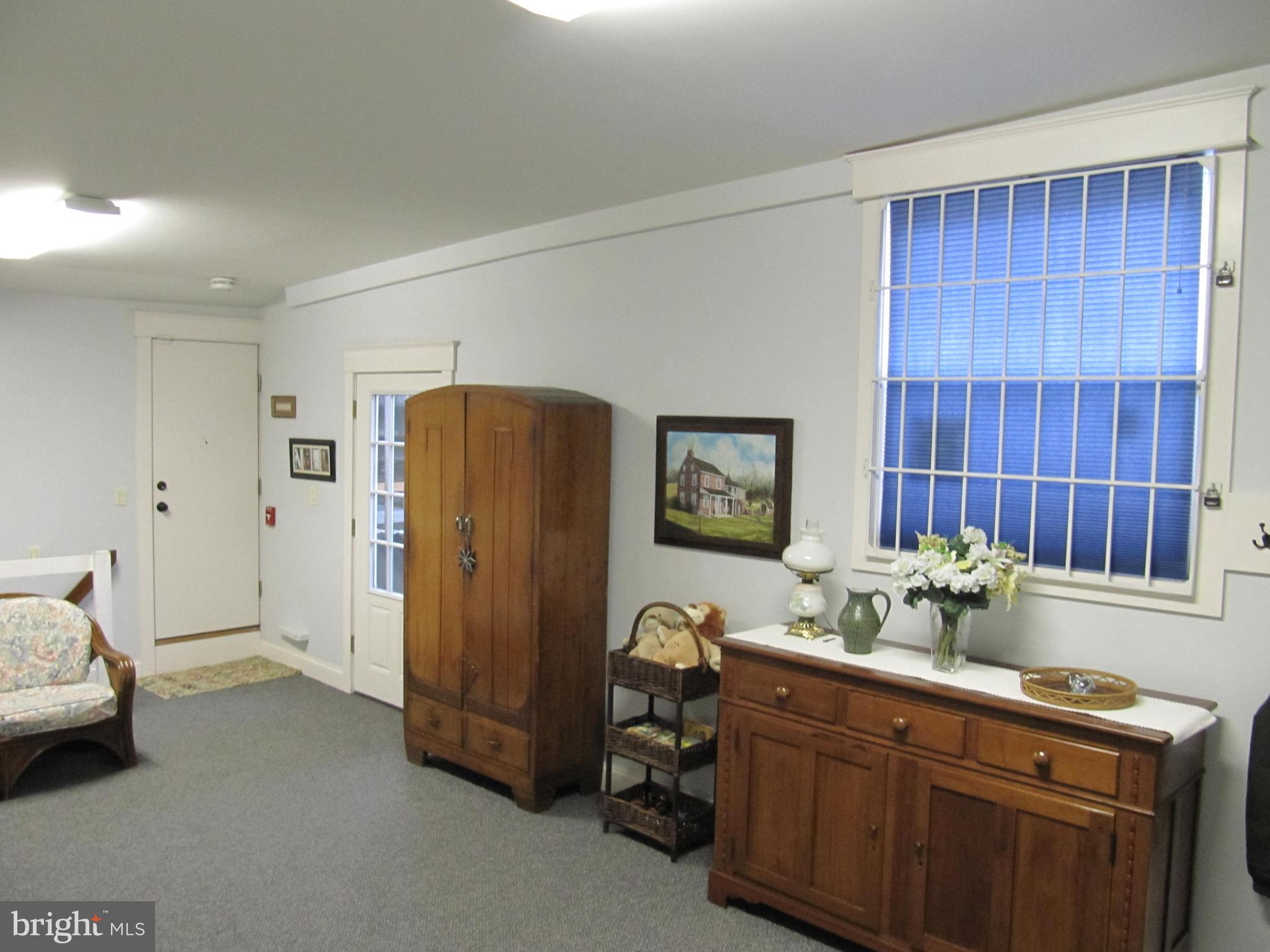 1043 Washington Street Reading, PA 19601 - Photo 20 of 40 a room with a table chair and cabinet