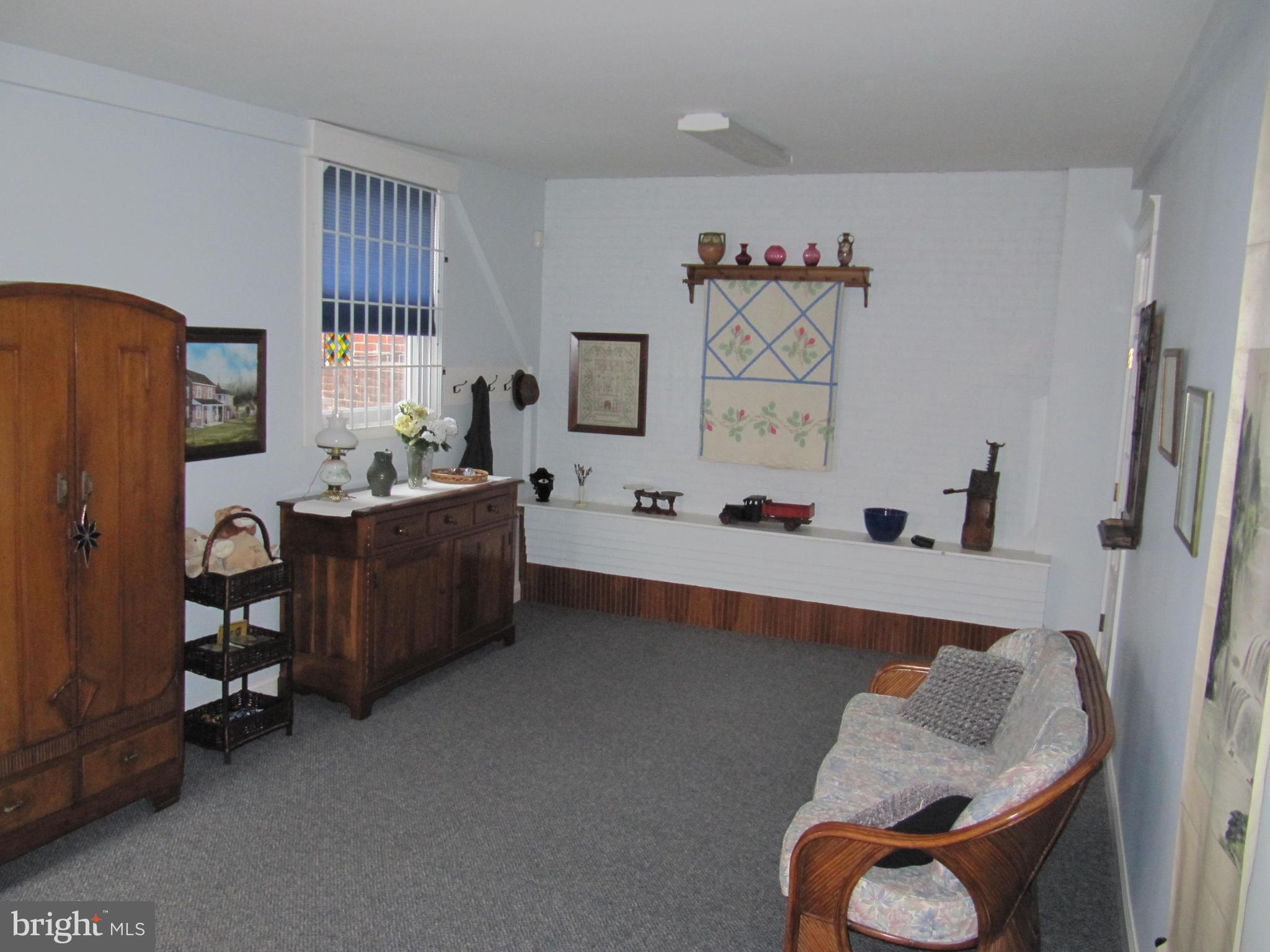 1043 Washington Street Reading, PA 19601 - Photo 21 of 40 a living room with furniture and a window