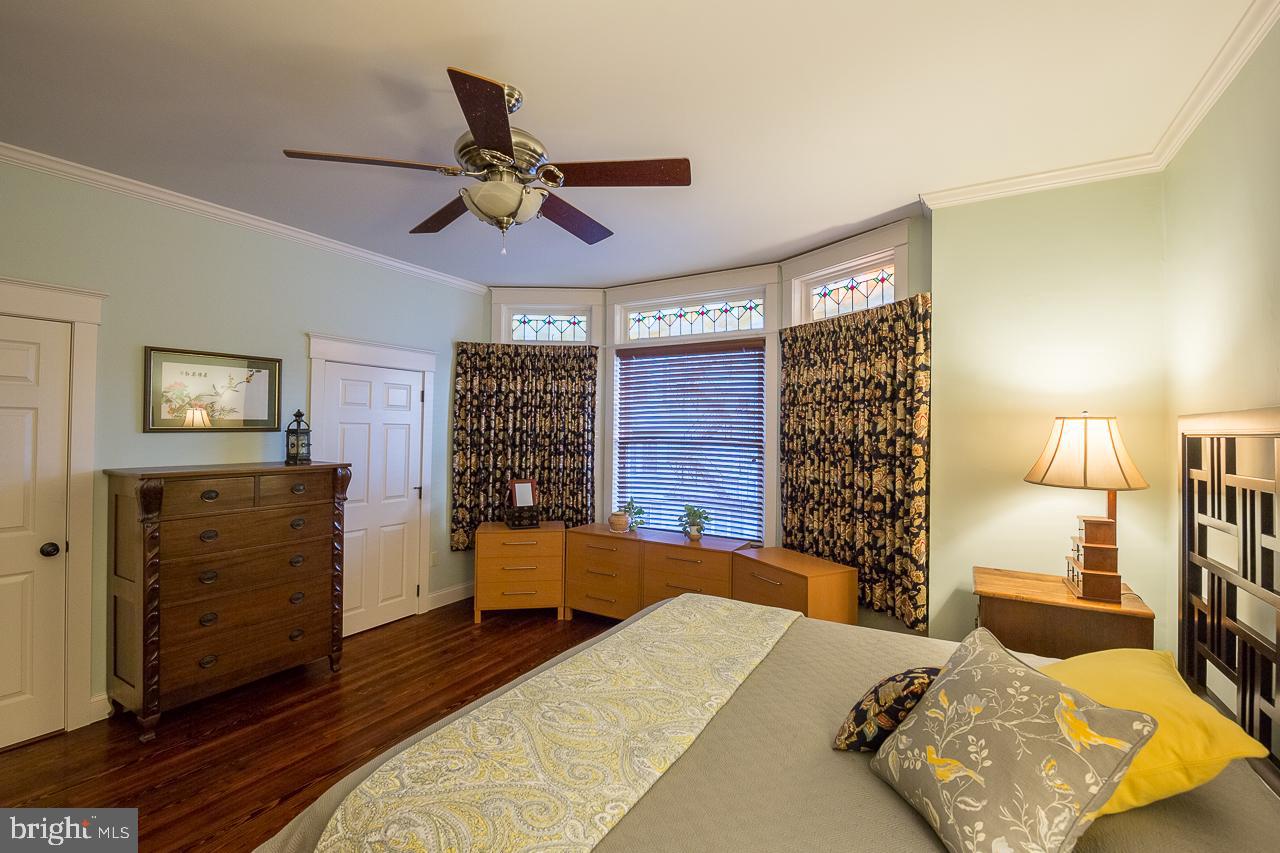 1043 Washington Street Reading, PA 19601 - Photo 27 of 40 a bedroom with a bed and wooden floor