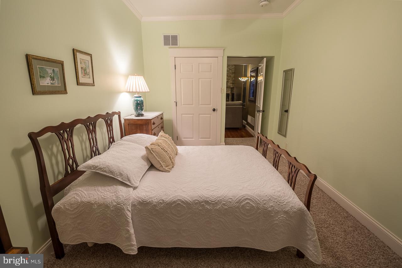 1043 Washington Street Reading, PA 19601 - Photo 34 of 40 a bedroom with a bed and a walk in closet