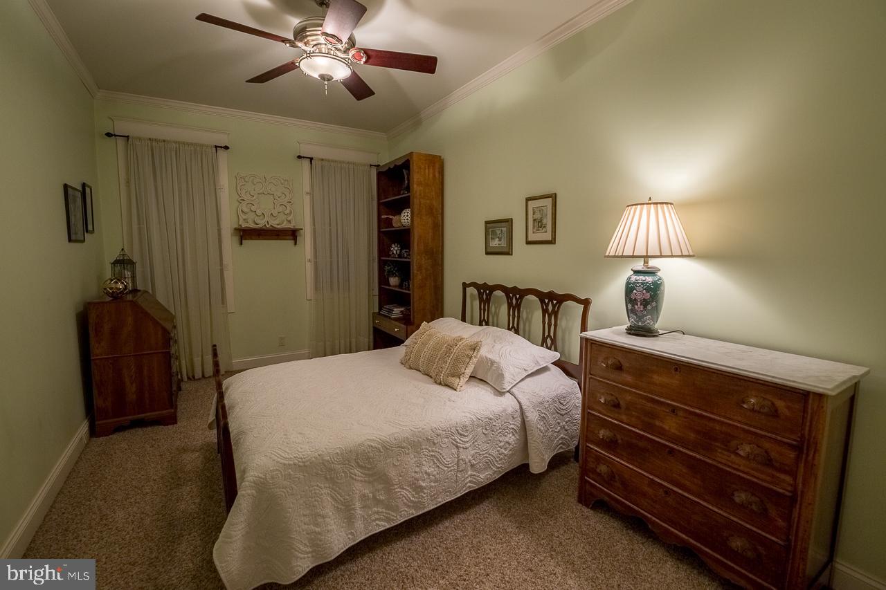 1043 Washington Street Reading, PA 19601 - Photo 35 of 40 a bedroom with a bed and a lamp