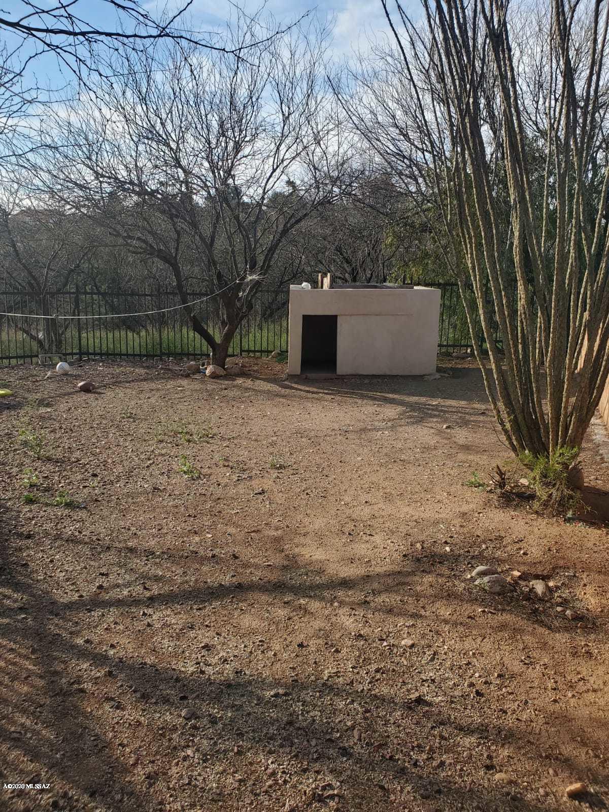 1186 Avenida Leon Rio Rico, AZ 85648 - Photo 31 of 31 a backyard of a house with lots of green space