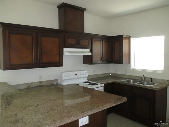 a kitchen with a sink and a cabinets