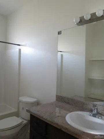 a bathroom with a sink toilet and vanity