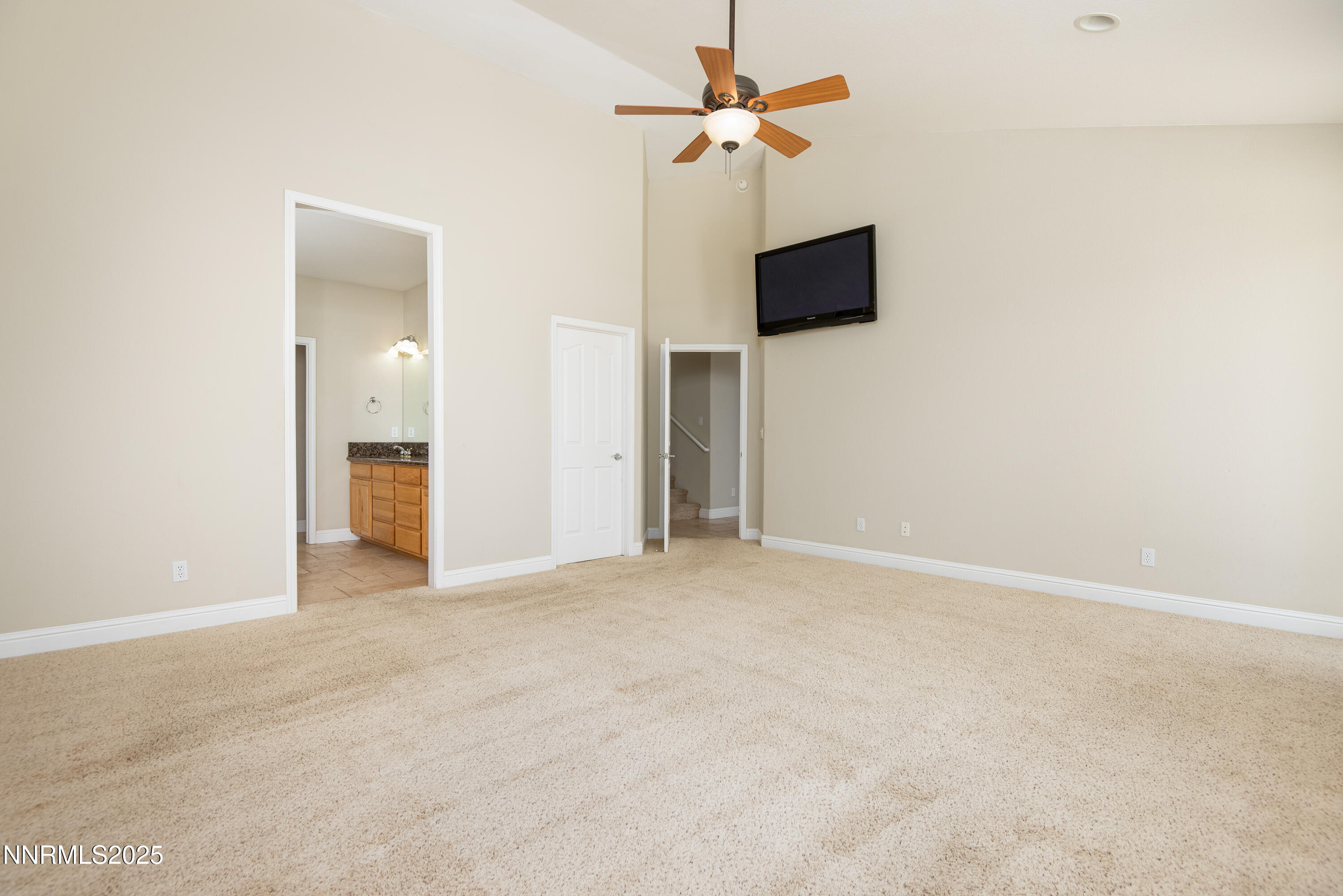 544 Upper Colony Road Wellington, NV 89444 - Photo 16 of 47 a view of an empty room with a fan