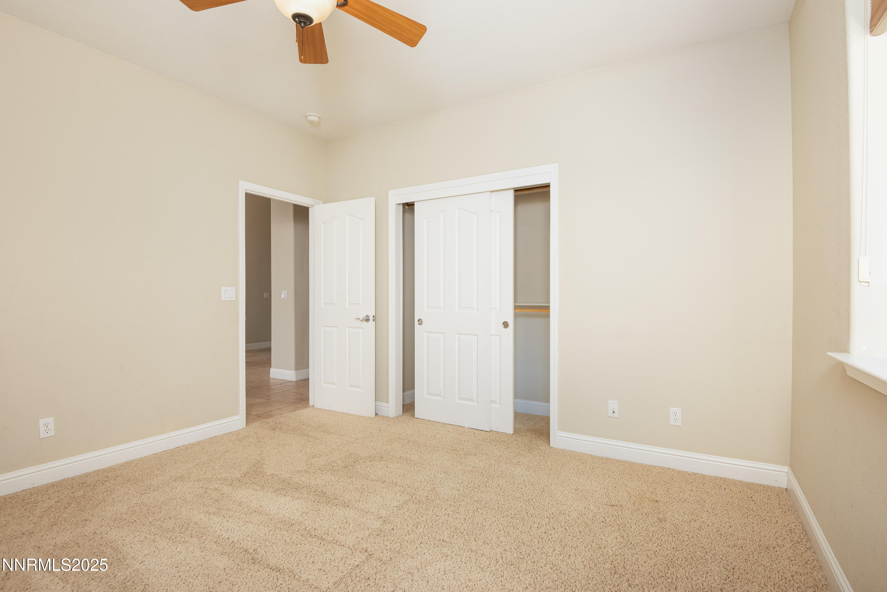 544 Upper Colony Road Wellington, NV 89444 - Photo 22 of 47 an empty room with ceiling fan and window