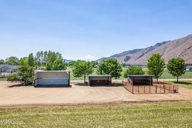 swimming pool view with a seating space