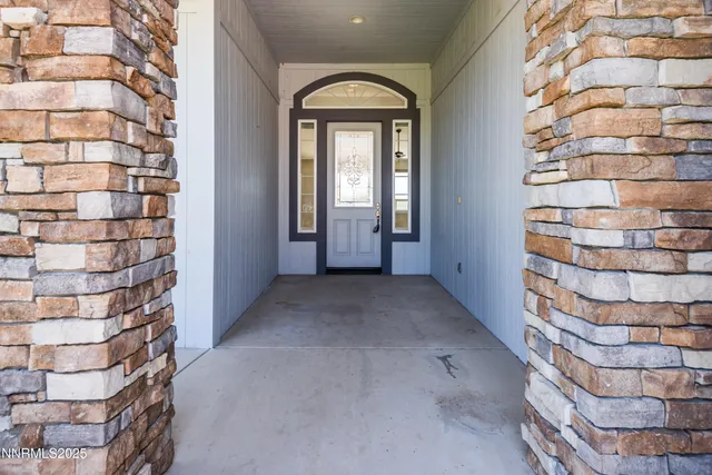 a view of entryway with a front door