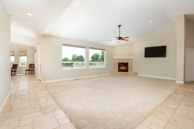 a view of an empty room with a fireplace