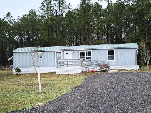 a house view with a backyard space