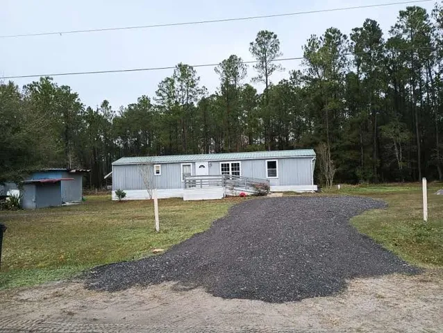 a house view with a garden space