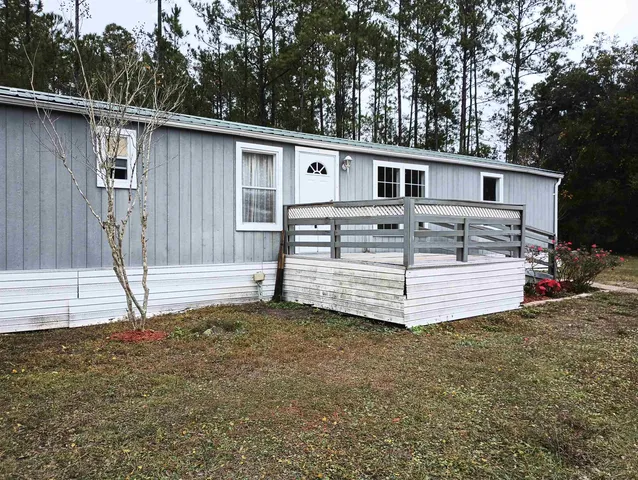 a view of a house with a back yard