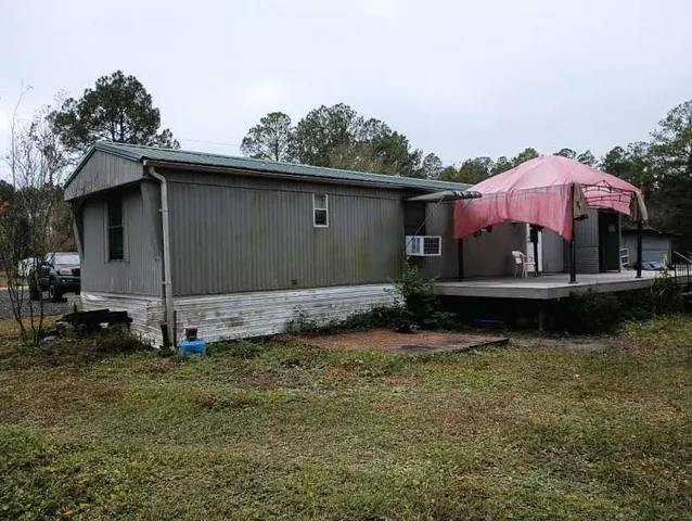a view of a backyard with a tub