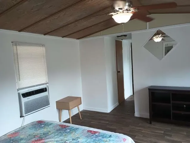 a view of a livingroom with furniture and wooden floor