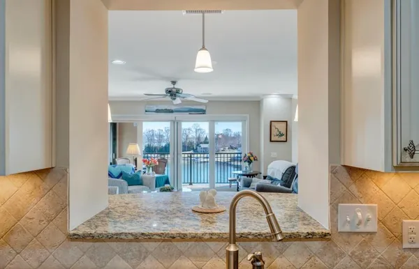 a bathroom with a tub a sink and a mirror