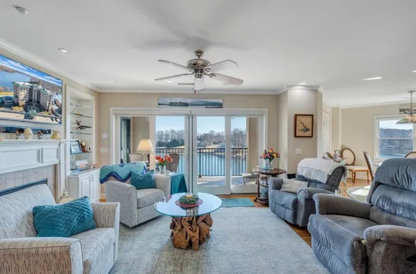 a living room with fireplace furniture and a flat screen tv