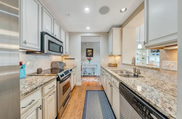 a view of a balcony with furniture