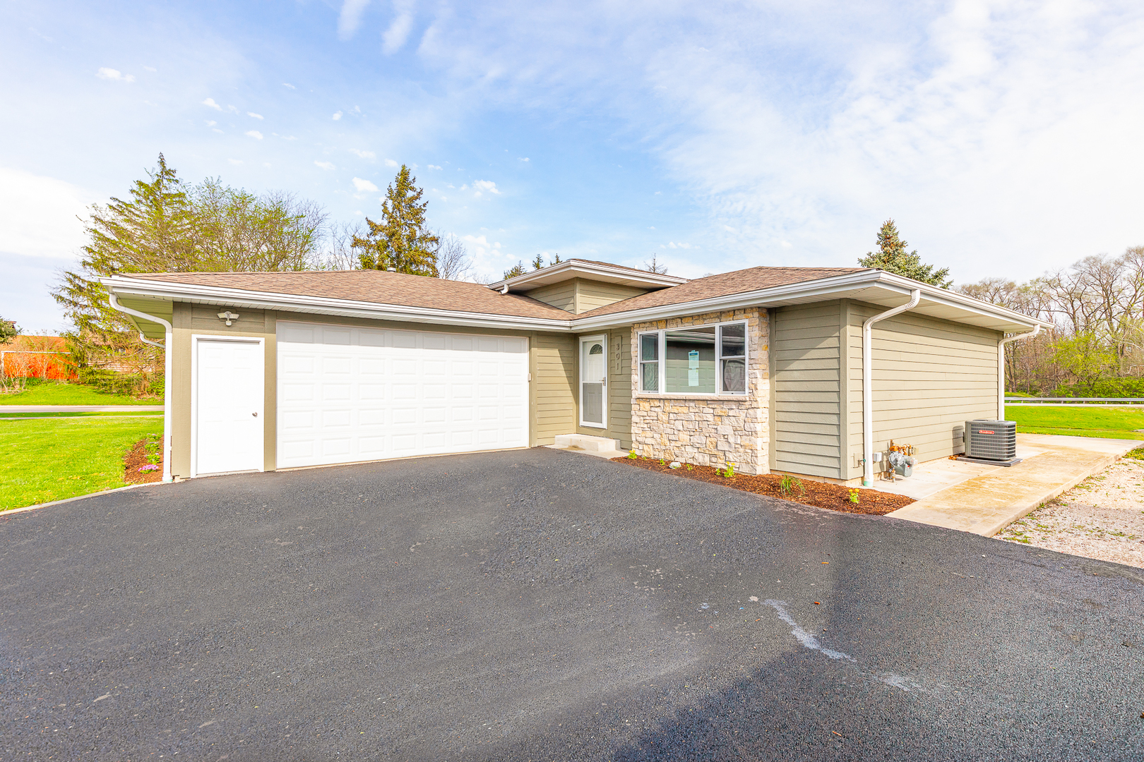 301 Stonegate Road New Lenox, IL 60451 - Photo 1 of 26 a view of a house with a backyard and a garage