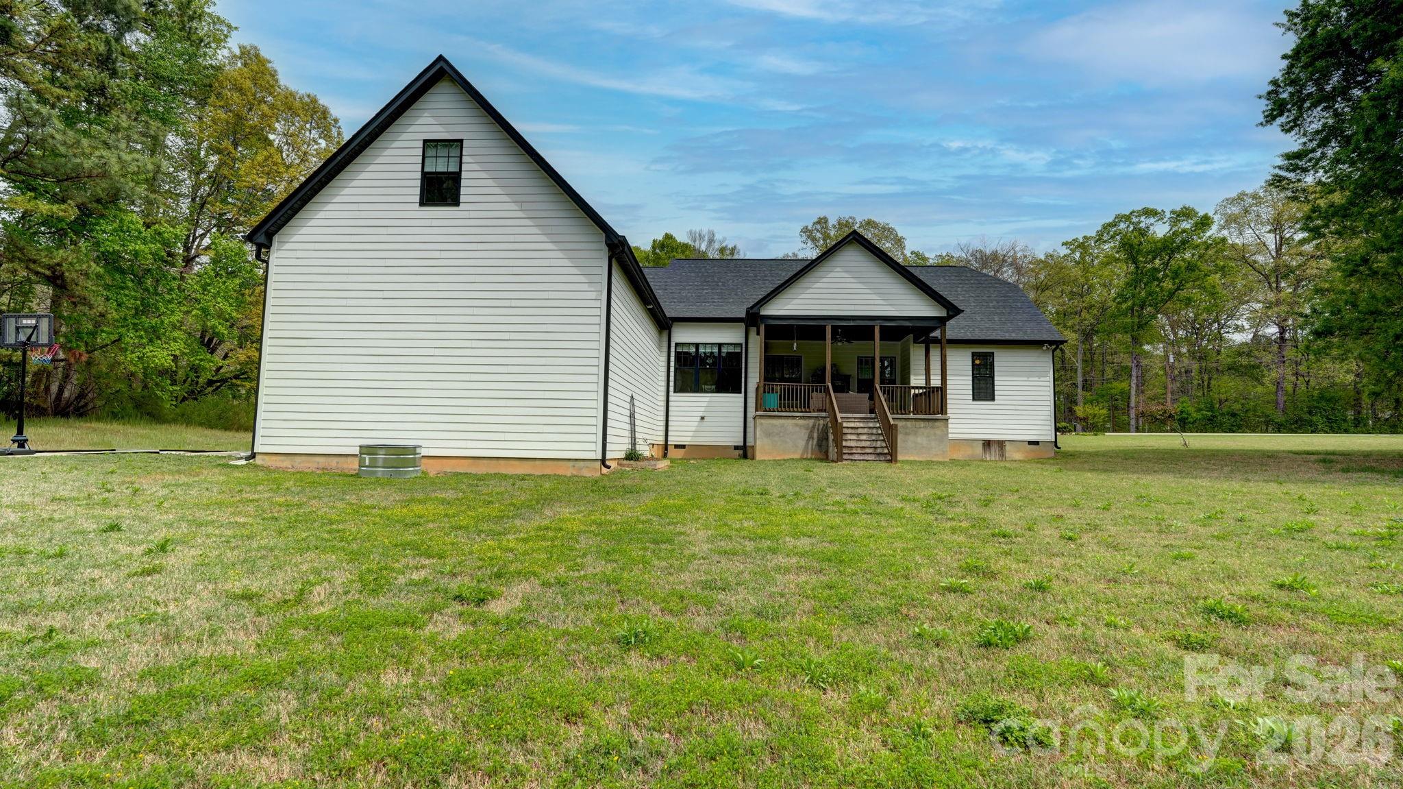 1775 Enochville Road Kannapolis, NC 28081 - Photo 26 of 41 a front view of a house with a garden