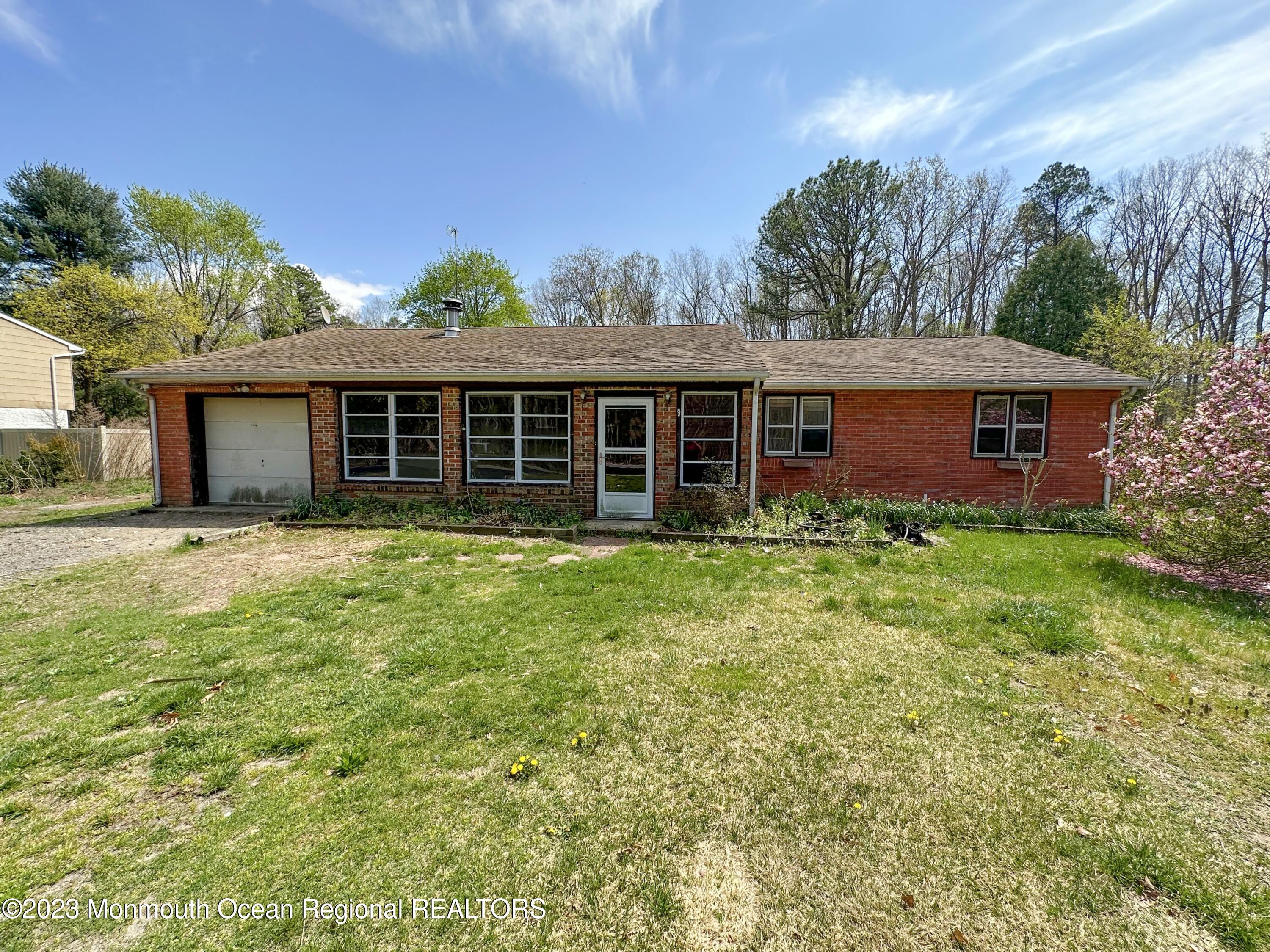 835 Bowman Road Jackson, NJ 08527 - Photo 1 of 10 front view of a house with a yard